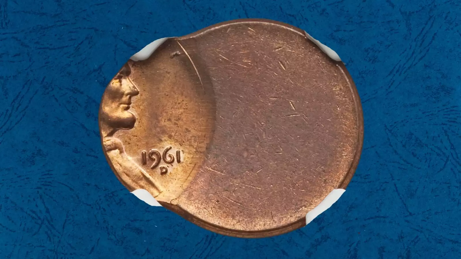 1961 Lincoln penny off-center strike error showing date and partial portrait shifted to one side with blank crescent opposite